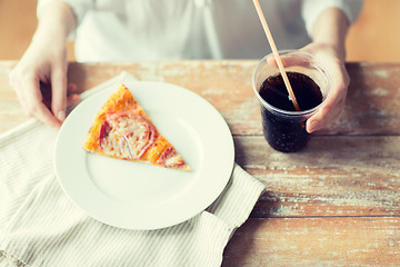 Image showing close up of woman with pizza and coca cola drink