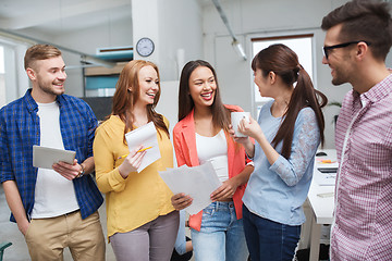 Image showing creative team on coffee break talking at office