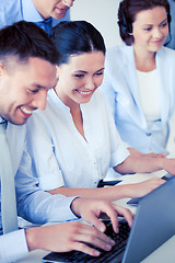 Image showing group of people working with laptops in office