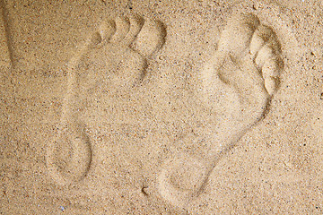 Image showing human feet print in the sand