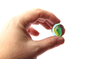 Image showing color glass sphere in the human hand