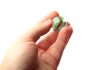 Image showing color glass sphere in the human hand