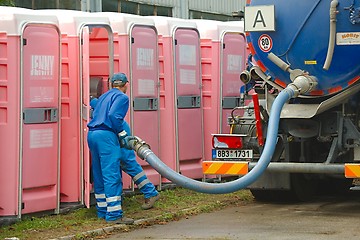 Image showing Toilets Being Cleaned