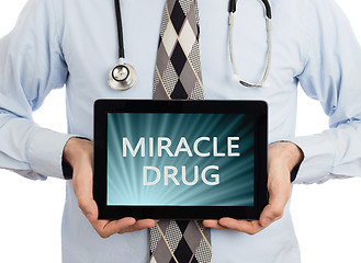 Image showing Doctor holding tablet - Miracle drug