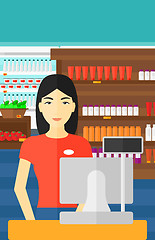 Image showing Saleslady standing at checkout.