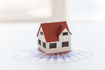 Image showing close up of home or house model and money