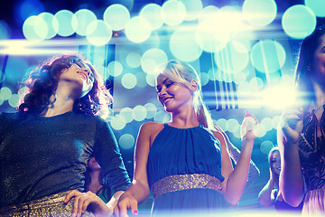 Image showing smiling friends dancing in club