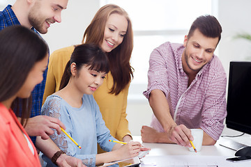 Image showing happy creative team or students working at office