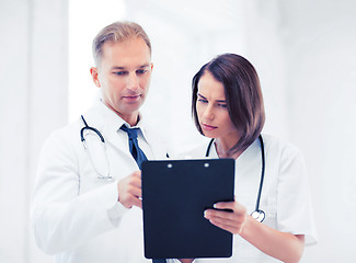 Image showing two doctors writing prescription