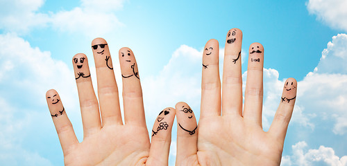 Image showing close up of hands and fingers with smiley faces