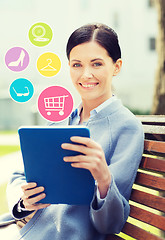 Image showing smiling business woman with tablet pc in city