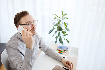 Image showing happy creative male worker calling on smarphone