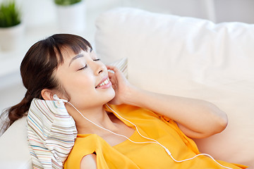 Image showing happy asian woman with earphones listening music