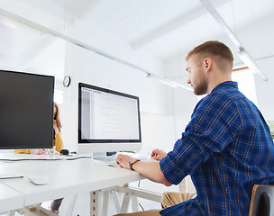 Image showing creative man or programmer with computer at office