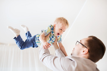 Image showing father with son playing and having fun at home