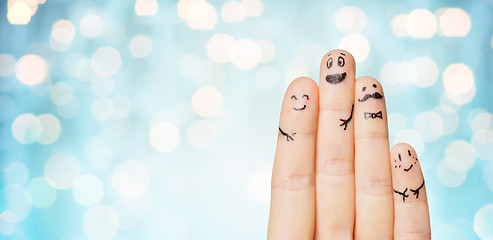 Image showing close up of hands and fingers with smiley faces