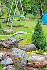 Image showing Alpine garden with green grass