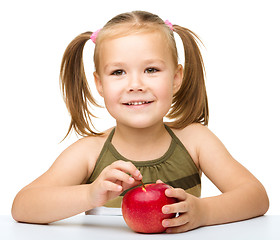 Image showing Little girl with red apple