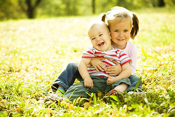 Image showing Children are playing in autumn park