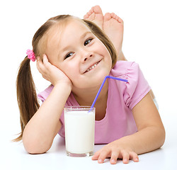 Image showing Cute little girl with a glass of milk