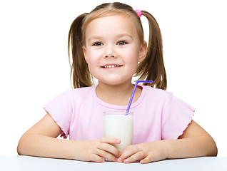 Image showing Cute little girl with a glass of milk