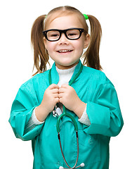 Image showing Cute little girl is playing doctor