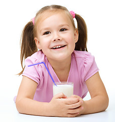 Image showing Cute little girl with a glass of milk