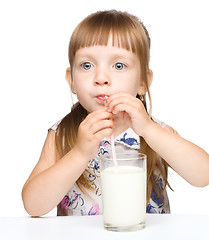 Image showing Cute little boy with a glass of milk