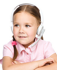 Image showing Young girl is working as an operator at helpline