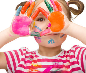 Image showing Portrait of a cute girl playing with paints