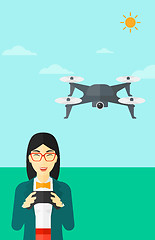 Image showing Woman flying drone.