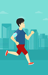 Image showing Man jogging with earphones and smartphone.