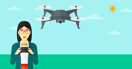 Image showing Woman flying drone.