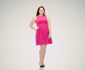 Image showing happy young plus size woman posing in pink dress