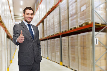 Image showing happy man at warehouse showing thumbs up gesture