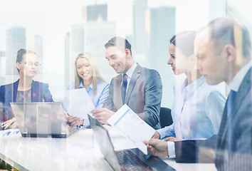 Image showing business team with laptop having discussion