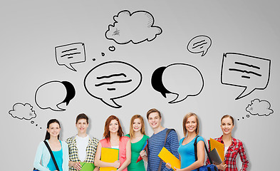 Image showing group of teenage students with folders and bags