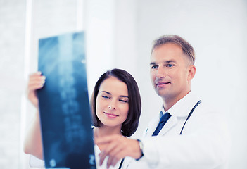 Image showing two doctors looking at x-ray