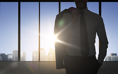 Image showing silhouette of business man over office background