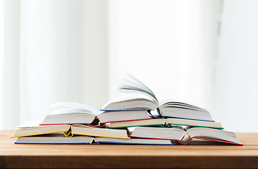 Image showing close up of books on wooden table