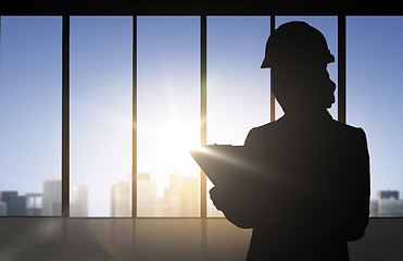 Image showing silhouette of woman in helmet with clipboard