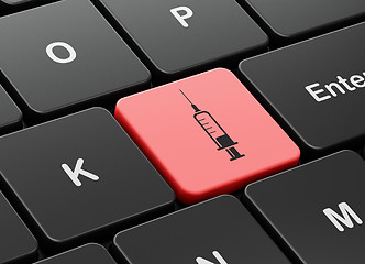 Image showing Medicine concept: Syringe on computer keyboard background