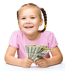 Image showing Little girl with dollars