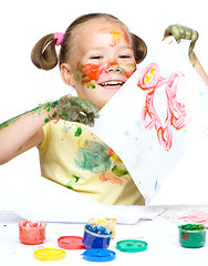 Image showing Portrait of a cute girl playing with paints