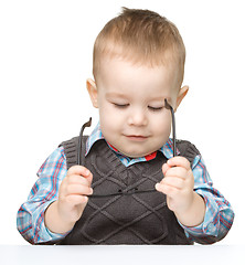 Image showing Portrait of a cute little boy wearing glasses