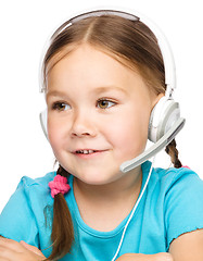 Image showing Young girl is working as an operator at helpline