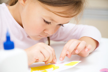 Image showing Little girl doing arts and crafts in preschool