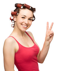 Image showing Woman is showing victory sign
