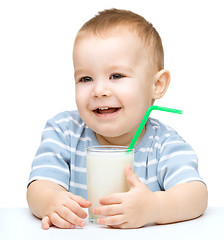 Image showing Cute little boy with a glass of milk