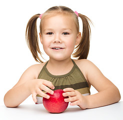 Image showing Little girl with red apple